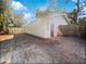 Newly constructed garage with a modern black door and a paved patio at 3030 46Th W Ave, Bradenton, FL 34207