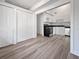 Open concept kitchen with white cabinets and gray flooring at 3030 46Th W Ave, Bradenton, FL 34207