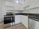 Modern kitchen featuring stainless steel appliances and dark countertops at 3030 46Th W Ave, Bradenton, FL 34207