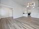 Open living room with hardwood floors and views into the kitchen area at 3030 46Th W Ave, Bradenton, FL 34207