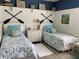 Twin bedroom with coastal decor and shared nightstand at 3375 Osprey Ln, Port Charlotte, FL 33953