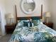 Main bedroom with floral bedding and wooden post bed at 3375 Osprey Ln, Port Charlotte, FL 33953