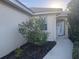 Home's entrance with walkway, landscaping, and white door at 3375 Osprey Ln, Port Charlotte, FL 33953