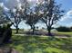 Landscaped golf course with mature trees and irrigation at 3375 Osprey Ln, Port Charlotte, FL 33953