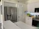 Stainless steel refrigerator and white kitchen cabinets at 3375 Osprey Ln, Port Charlotte, FL 33953