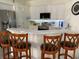 Kitchen with white cabinets and stainless steel appliances at 3375 Osprey Ln, Port Charlotte, FL 33953