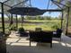 Spacious lanai overlooking golf course with seating at 3375 Osprey Ln, Port Charlotte, FL 33953