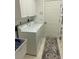 Laundry room with washer, dryer and built in cabinets at 3375 Osprey Ln, Port Charlotte, FL 33953