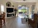 Living area features a fireplace and access to a patio at 3375 Osprey Ln, Port Charlotte, FL 33953