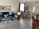 Bright living room and dining area with hardwood floors at 3375 Osprey Ln, Port Charlotte, FL 33953