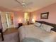 Main bedroom with a king-size bed and a walk-in closet at 7580 Camminare Dr, Sarasota, FL 34238