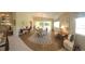 Elegant dining room features hardwood floors and a chandelier at 7580 Camminare Dr, Sarasota, FL 34238