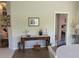 Home entryway featuring a console table and a view into a bedroom at 7580 Camminare Dr, Sarasota, FL 34238