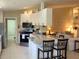 Modern kitchen with granite countertops and stainless steel appliances at 7580 Camminare Dr, Sarasota, FL 34238
