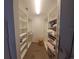 Large walk-in closet with ample shelving and storage at 7580 Camminare Dr, Sarasota, FL 34238