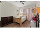 Bedroom with a wooden bed frame and light pink curtains at 8235 Gulf Way, Hudson, FL 34667