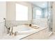 Relaxing bathroom with soaking tub and glass shower at 13015 Homestead Ln, Parrish, FL 34219