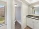 Bathroom with shower, modern vanity, and neutral color palette at 14315 Knoll Ridge Dr, Tampa, FL 33625