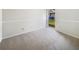 Clean and simple bedroom design with neutral carpet and a window view at 14315 Knoll Ridge Dr, Tampa, FL 33625