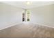 Neutral bedroom with carpet, natural light and base molding at 14315 Knoll Ridge Dr, Tampa, FL 33625