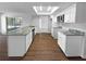 Spacious kitchen boasts granite countertops, white cabinetry, stainless steel appliances, and ample lighting at 14315 Knoll Ridge Dr, Tampa, FL 33625
