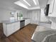 Modern kitchen featuring granite countertops, white cabinets, and stainless steel appliances at 14315 Knoll Ridge Dr, Tampa, FL 33625