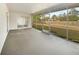 The screened lanai offers an outdoor space with views of the back yard at 14315 Knoll Ridge Dr, Tampa, FL 33625