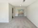 Bright living room features sliding glass doors that lead to the backyard at 14315 Knoll Ridge Dr, Tampa, FL 33625