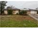 Ranch style home with mature landscaping and large yard at 23102 Maclellan Ave, Port Charlotte, FL 33980