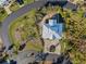 Bird's eye view of a single-Gathering home with a metal roof and driveway at 7092 Baypine Ln, Englewood, FL 34224