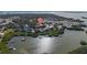 Property located on a waterway with nearby houses and boats at 7092 Baypine Ln, Englewood, FL 34224