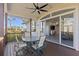 Spacious deck with seating area and access to interior at 7092 Baypine Ln, Englewood, FL 34224