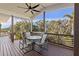 Outdoor deck with seating area and scenic view at 7092 Baypine Ln, Englewood, FL 34224