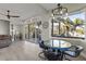 Bright dining area with ocean view and unique table at 7092 Baypine Ln, Englewood, FL 34224