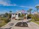 Two-story house with attached garage and circular driveway at 7092 Baypine Ln, Englewood, FL 34224