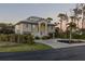 Two-story house with attached garage and circular driveway at 7092 Baypine Ln, Englewood, FL 34224