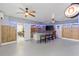 Game room features a bar with seating, TV, and coastal decor at 7092 Baypine Ln, Englewood, FL 34224