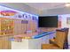 Epoxy bar top and coastal decor highlight this game room bar at 7092 Baypine Ln, Englewood, FL 34224