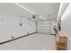 Spacious garage with overhead door and ample storage at 7092 Baypine Ln, Englewood, FL 34224