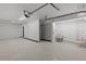 Clean and bright garage with a utility sink and toilet at 7092 Baypine Ln, Englewood, FL 34224