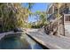 Private pool and patio area with lush landscaping at 7092 Baypine Ln, Englewood, FL 34224