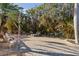 Relaxing patio with pool, lounge chairs and tropical plants at 7092 Baypine Ln, Englewood, FL 34224