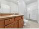 Clean bathroom with shower, toilet and wood vanity at 3473 Parkridge Cir # 17-101, Sarasota, FL 34243