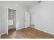Spacious bedroom featuring wood-look flooring and ample closet space at 3473 Parkridge Cir # 17-101, Sarasota, FL 34243