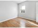 Bright bedroom with wood flooring and large window at 3473 Parkridge Cir # 17-101, Sarasota, FL 34243