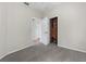 Cozy bedroom with grey carpet and a built-in wooden closet at 3473 Parkridge Cir # 17-101, Sarasota, FL 34243
