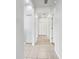 Bright hallway with tile flooring and multiple doors leading to other rooms at 3473 Parkridge Cir # 17-101, Sarasota, FL 34243