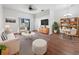 Bright living room features hardwood floors, stylish furniture, and a neutral color palette at 3473 Parkridge Cir # 17-101, Sarasota, FL 34243