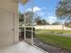 Screened-in patio overlooking a grassy backyard at 3473 Parkridge Cir # 17-101, Sarasota, FL 34243
