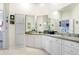 Double vanity bathroom with walk-in shower at 6650 100Th N Way # 25C, St Petersburg, FL 33708
